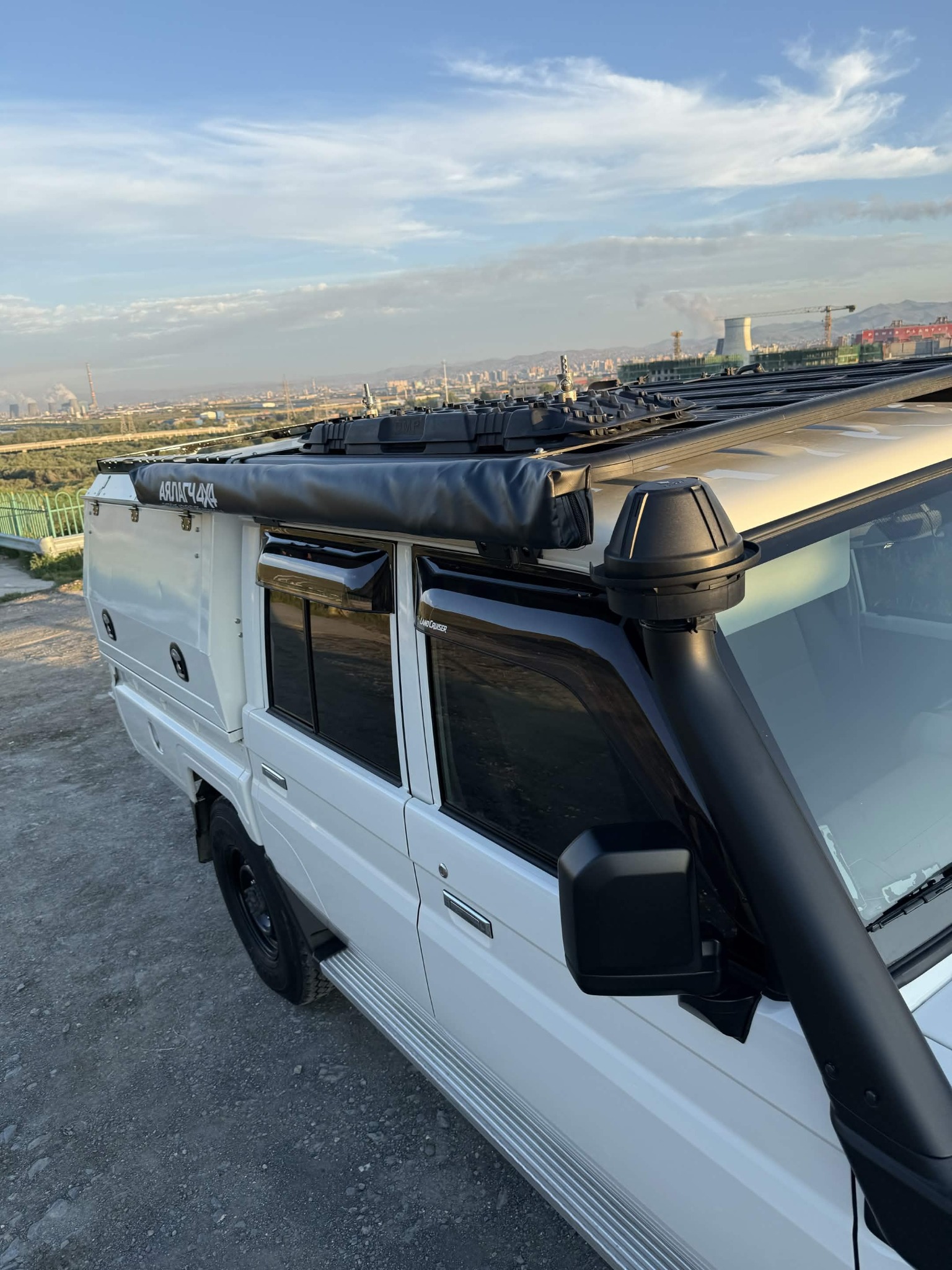 White Toyota Land Cruiser 79 with overland canopy